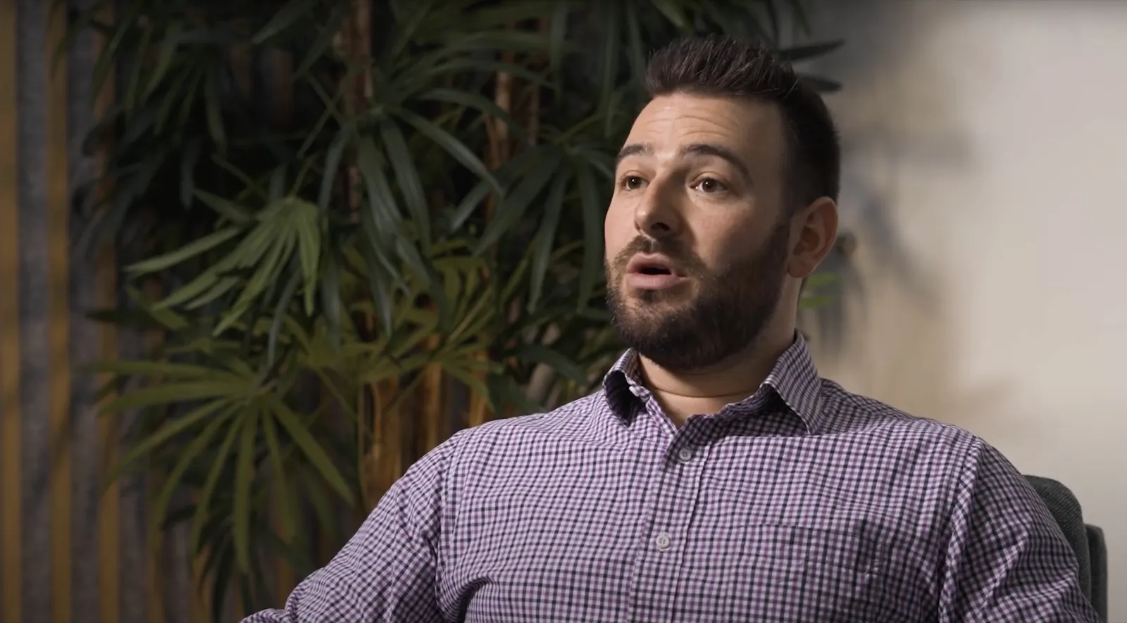 Person speaking during an interview in an office
